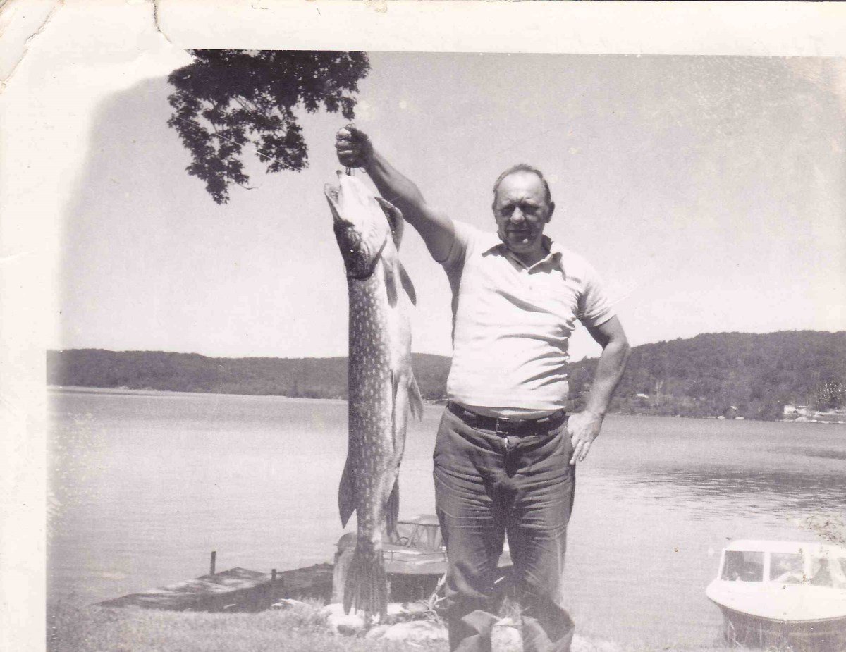 Don’s dad with a massive pike at Doe Lake — black and white