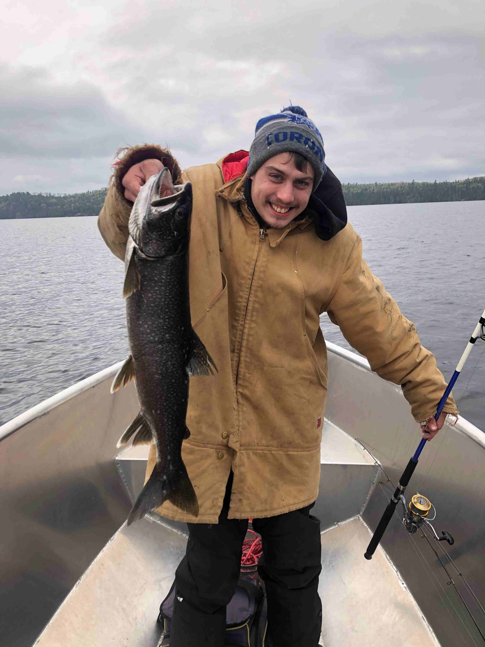 Devin holding his first lake trout on Dog Lake, Missanabie, May 2023